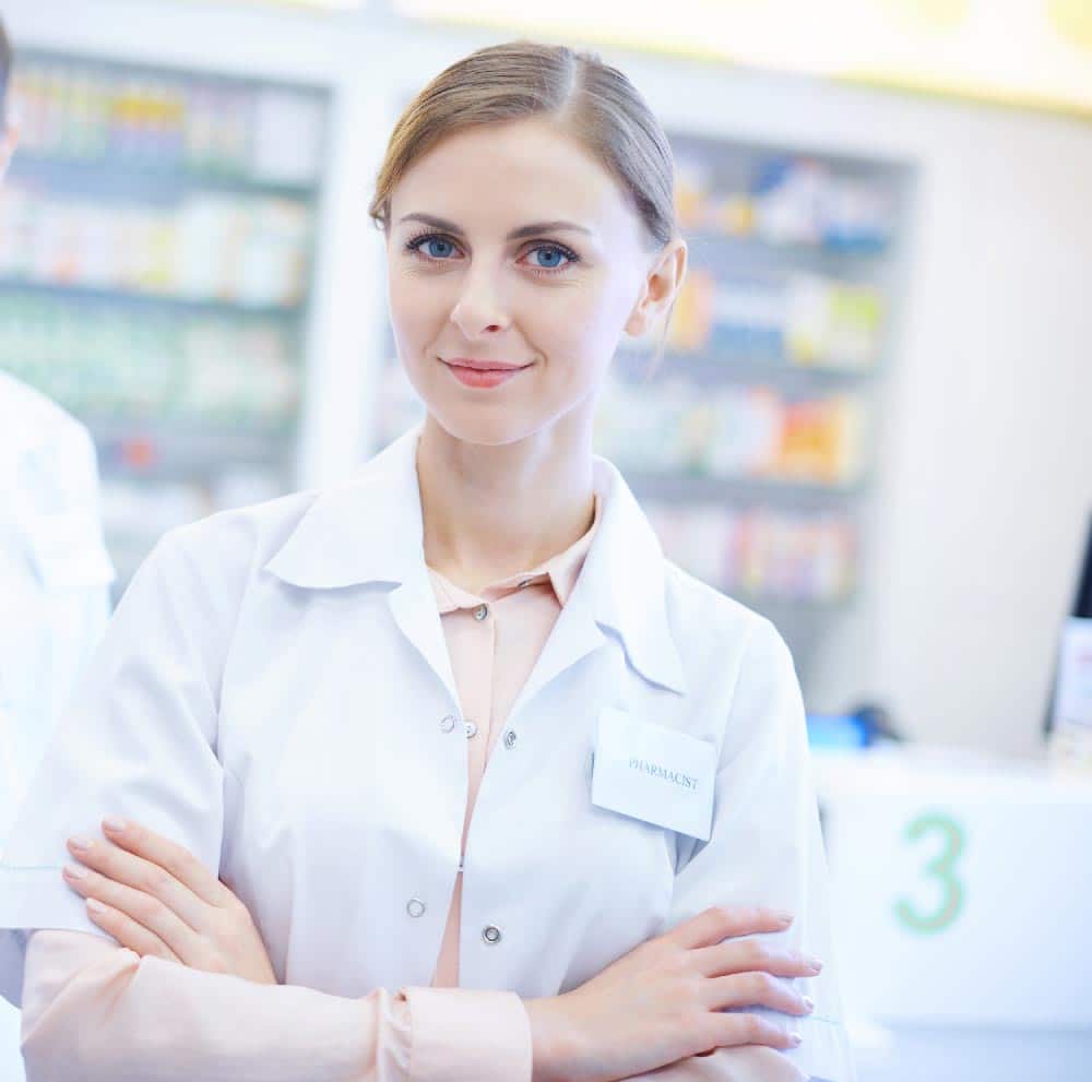 blonde pharmacist with folded arms