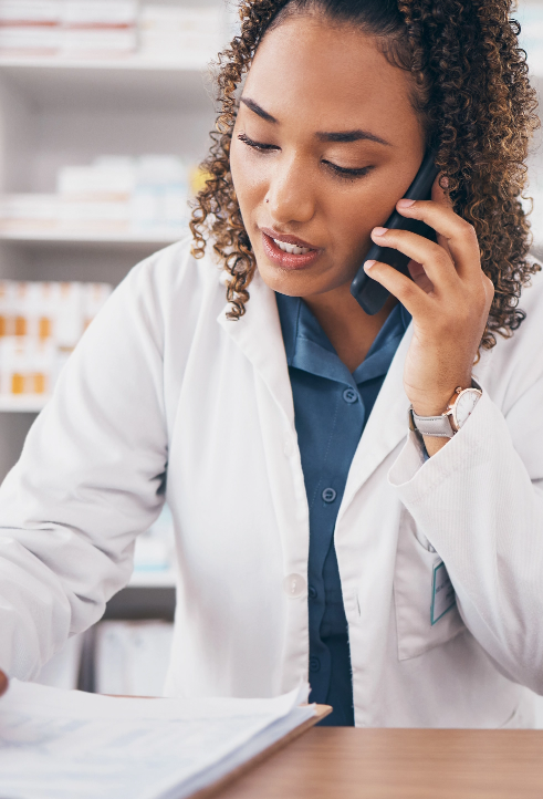 Pharmacist on the phone with a customer