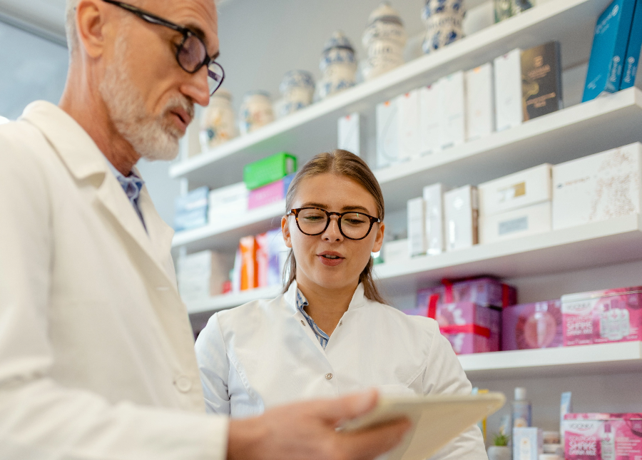 Two pharmacist looking at a patient chart